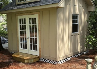 10 x 12 Heritage 812 pitch with Board and batten siding, upgraded doors, dormer added
