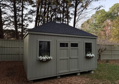 10 x 16 Premium Statesman with hip roof, additional window, transom window in doors, and flower boxes added