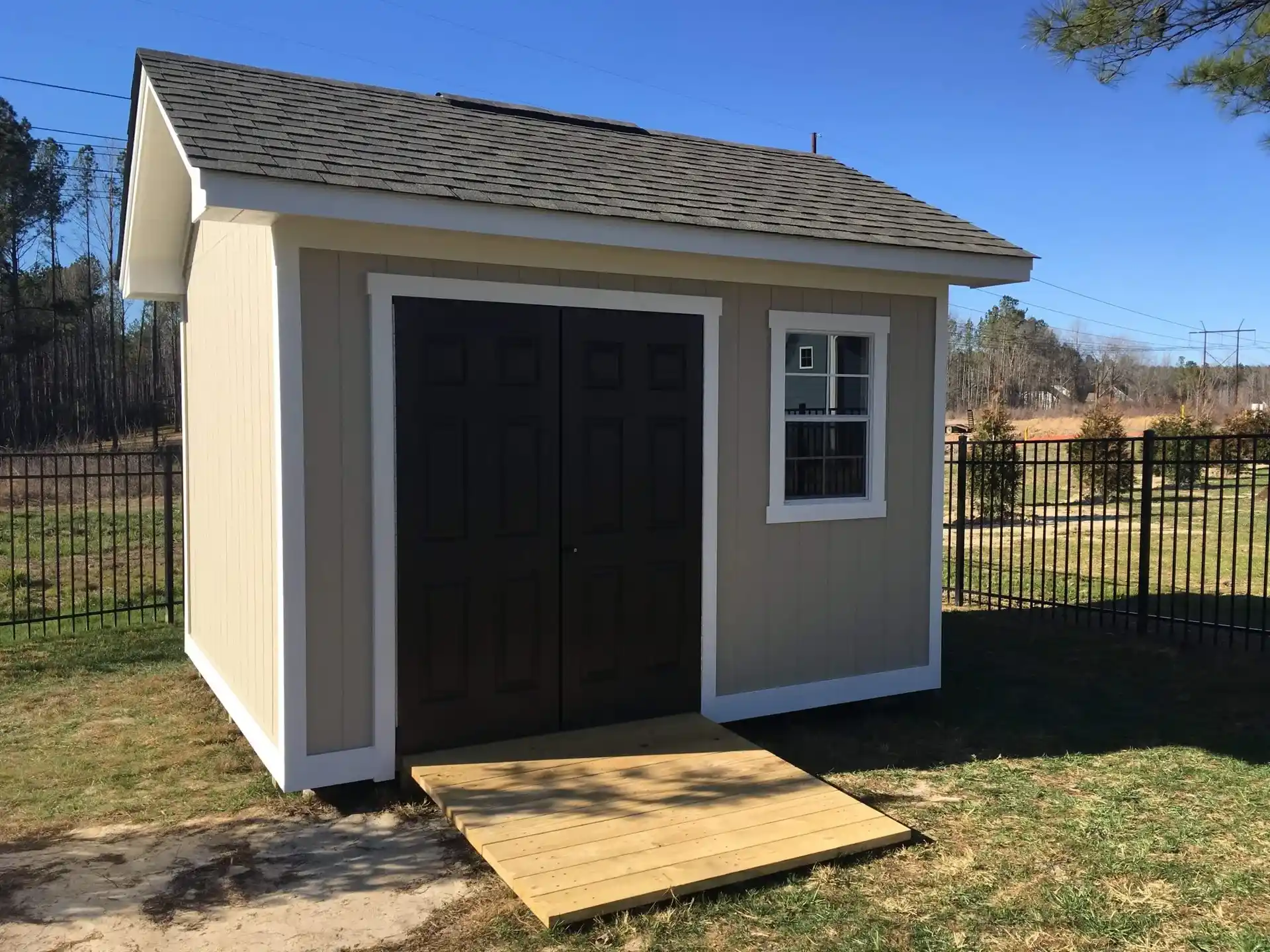 tan heritage with white craftsman style trim and black doors
