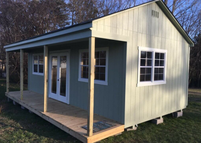 The cabin is a custom shed perfect for a pool house