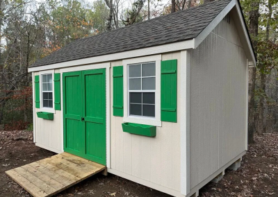 Premium statesman shed with green doors and shutters
