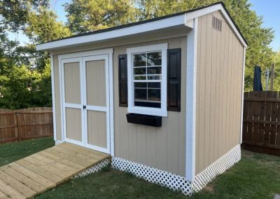 Custom built tackroom backyard barn with gable doors